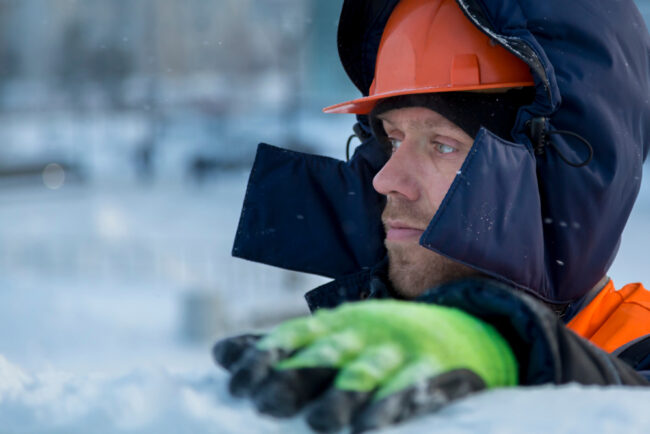Close-up,Of,A,Worker,At,The,Construction,Of,An,Ice 7 Winter Weather Safety Tips For Contractors