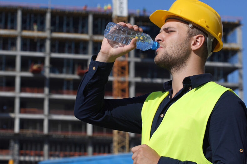 Engineer,Man,Drink,Water,In,A,Hot,Summer,Day,,Worker Worker Safety In The Summer – How To Address Heat-Related Hazards