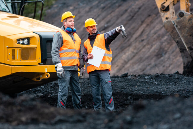Worker,With,A,Plan,And,A,Clipboard,Discussing,Super,Important