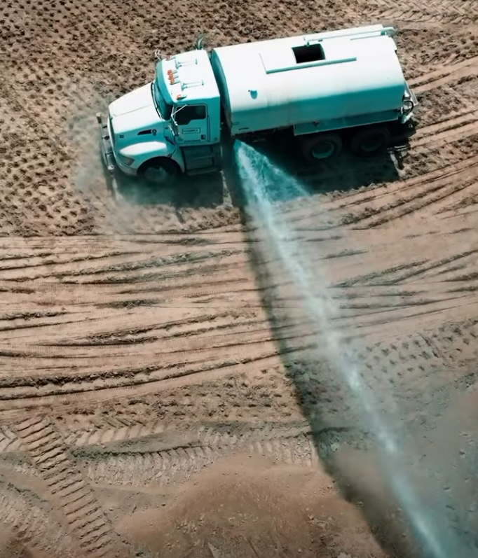 Water truck adding moisture for compaction at the Mound City TA Travel Center project